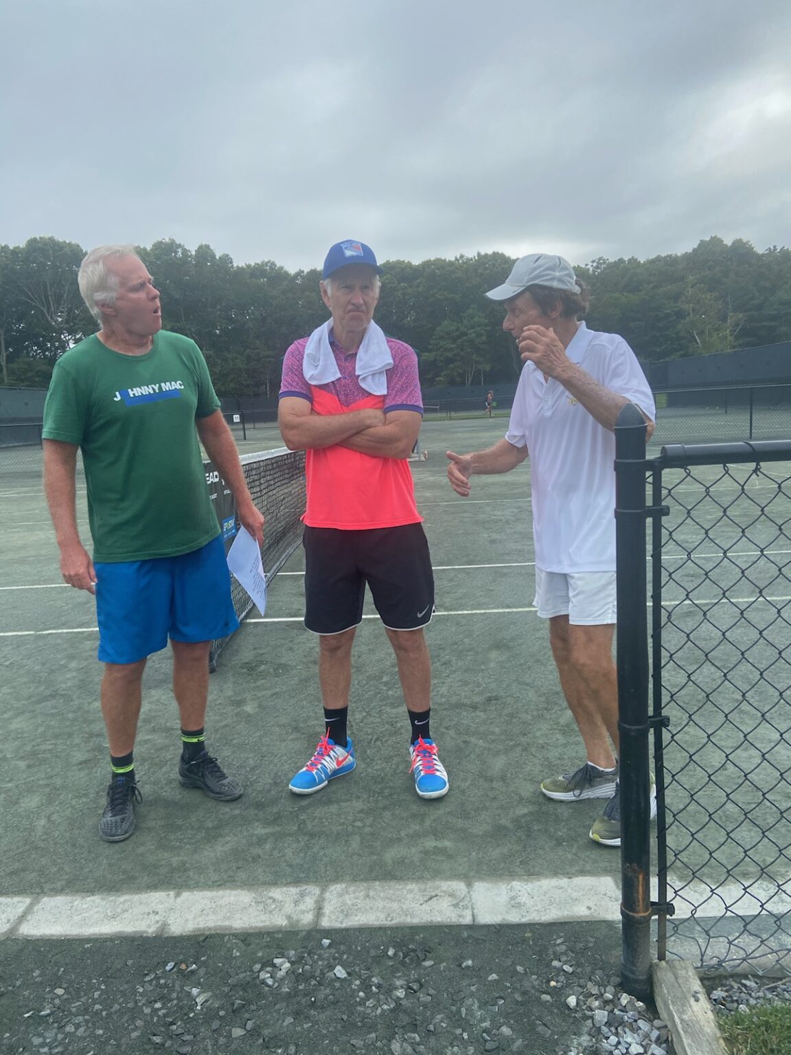 In the midst of a Pro Am tennis event, Marshall Hubsher offers strategic insights to John and Patrick McEnroe, with a focus on the nuanced art of the drop shot.